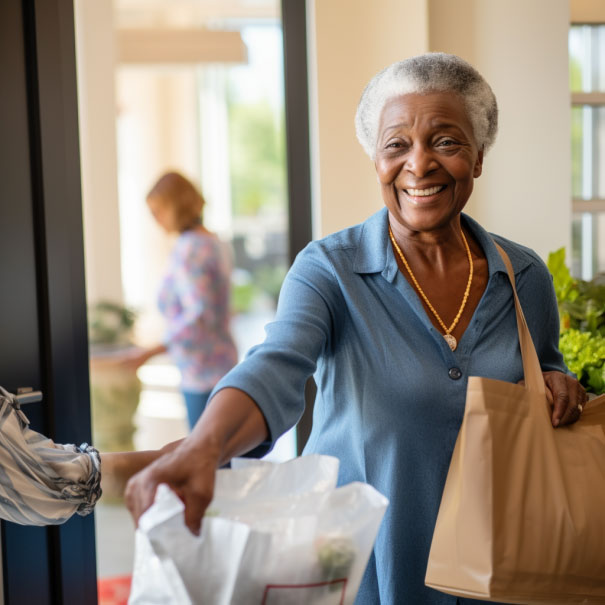 African american senior woman inblue holding bag