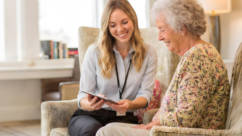 Dietitian reviewing information with an older adult